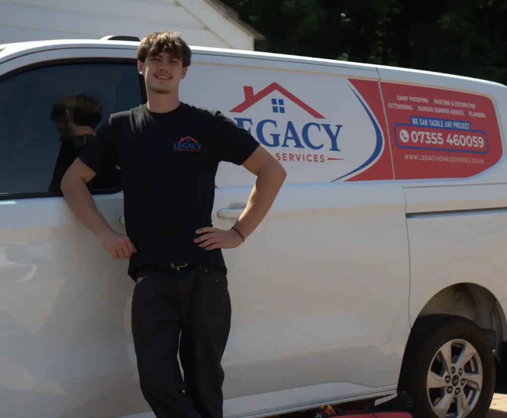 Legacy Home Services team member with branded home services van