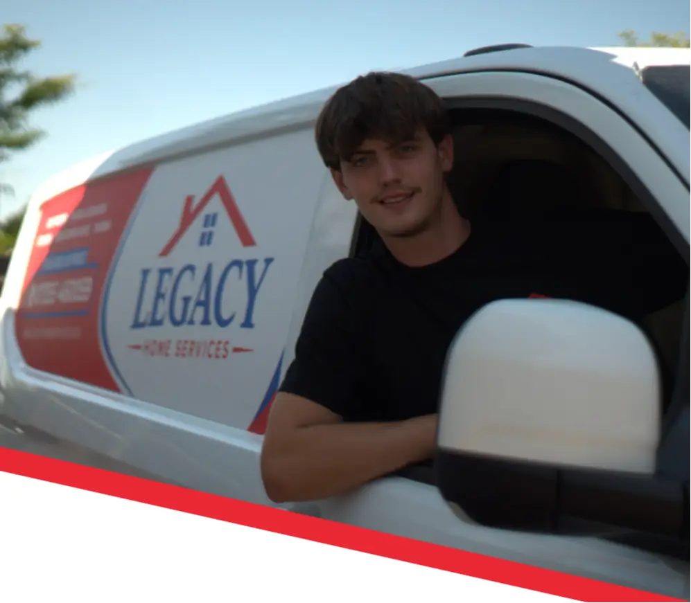Legacy Home Services team member with branded service van